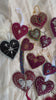 A video of Girdle of Venus' velvet hand-sewn heart ornaments.